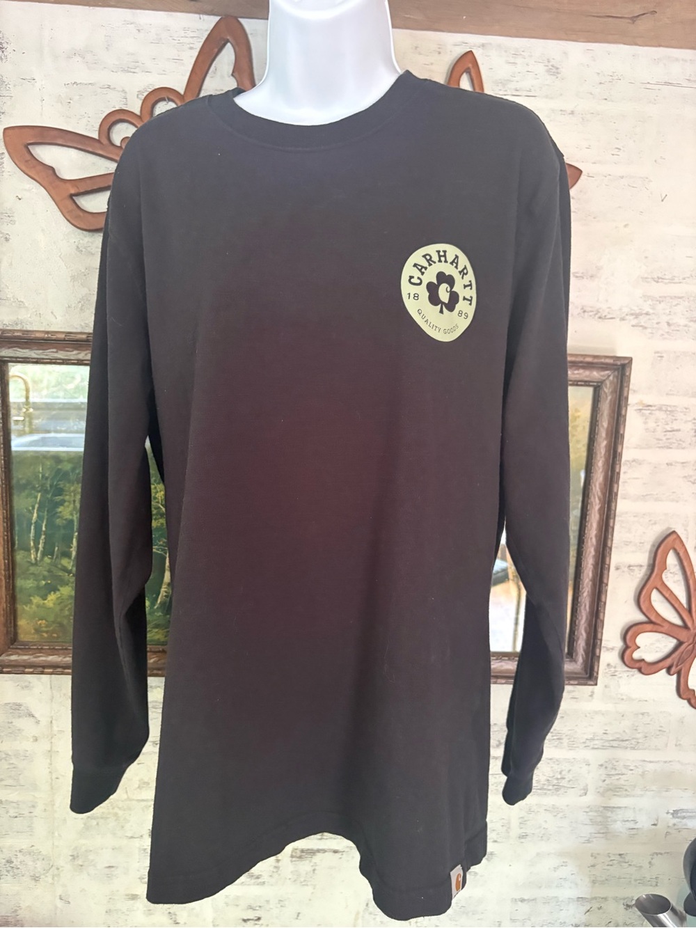 Carhartt long-sleeve shirt features a clover logo for St. Patrick's Day